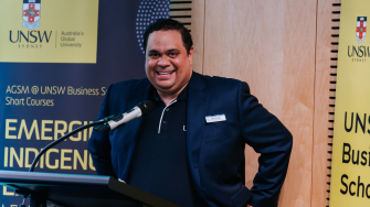 Amos Taylor (Gidja/Jaru man and student) at UNSW smiles as he presents at an AGSM short course