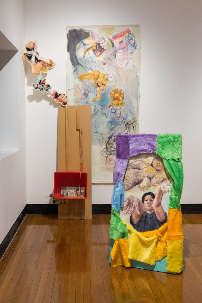 Mei Lin Meyers, ‘Fruit Bag Core’ 2025. Oil on recycled unstretched canvas, plywood, faux fur, paracord, images on printer paper, spray paint, polyester thread, buttons, acupressure ring, metal fixtures, tiger balm, family storage container, recycled calico and polyester fill, op-shop glass bowl; Floor work: approx. 130 x 50 x 15cm; Wall work: approx. 260 x 70cm.