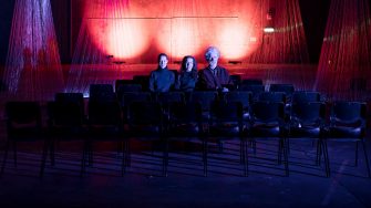 SAM Alumni sitting in theatre