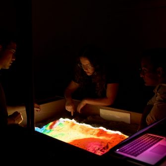 Students using technology in the City Futures Lab at the School of Built Environment