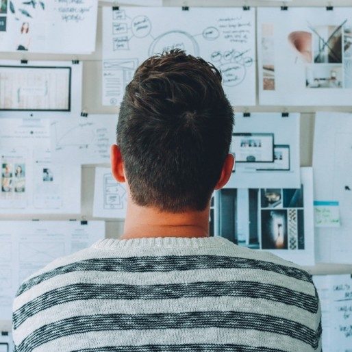 looking at a wall of papers