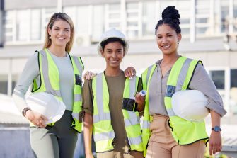 Architecture, women construction team and diversity in portrait, contractor group with smile at building site. Architect, engineering female with solidarity and trust in collaboration with builder.