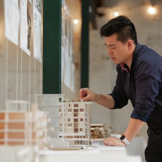 Student with architecture model