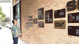 Alex-Vasudevan looking at Phillip Room wall