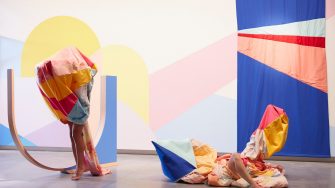 Rochelle Haley, Dance on a couch by an open window (after Boyd), 2021, acrylic paint, beech timber, canvas, calico, cotton drill, fabric dye, crayon, pastel, ink, charcoal, feather down, magnets, rope, and performance. Costume designer: Leah Giblin. Choreographers/Performers: Angela Goh and Ivey Wawn. Fabricator: Kazu Quill. 