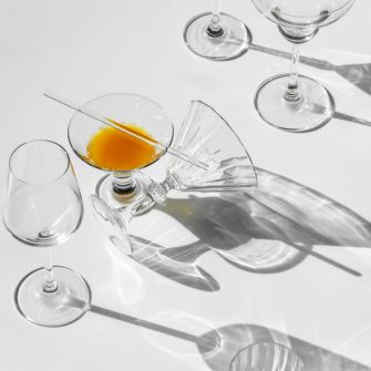 An assortment of empty elegant glasses on a white background