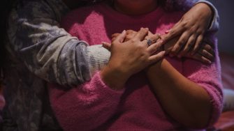 Close up of a young couple hugging - Refinery29 Australia - We Are Many Image Gallery