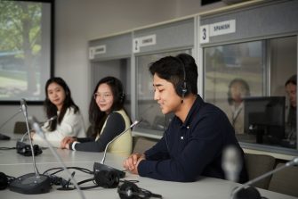 Students learning at the translation booth room at UNSW Kensignton campus.