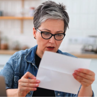Woman paying tax bill
