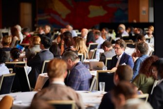 Busines School Conference audience members and speakers