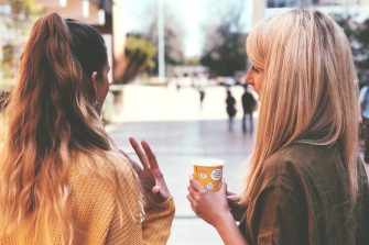Two women having a chat at the main walkway