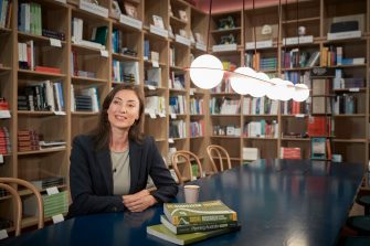 Business School Social Impact postgraduate student in café