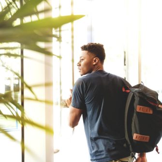 Student going through glass doors