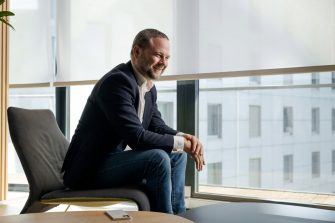 Man sitting on chair smiling