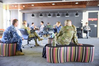 ADFA Canberra UNSW students sitting on lounges talking