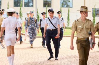 Students in uniform walking through the UNSW Canberra campus