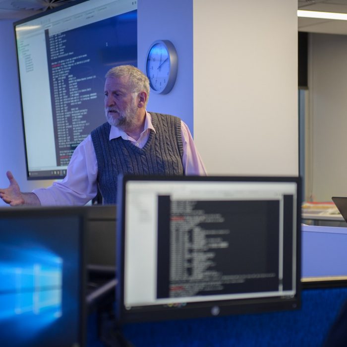 Roger Smith presenting Cyber Security Workshop to an internantional contingent visiting UNSW Canberra Cyber.