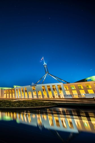 Facade of new parliament house in Canberra at night