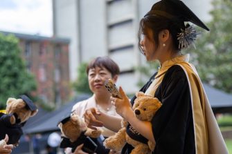 Students and guests celebrating Graduations at the March 2025 ceremonies on Kensington Campus