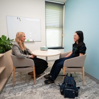A student is being attended by a professional from the Health Services team