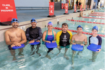 Group photo in pool with UNSW Water Safety Program participants