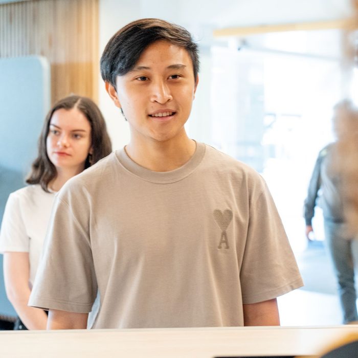 Student speaking with a staff member at The Nucleus: Student Hub