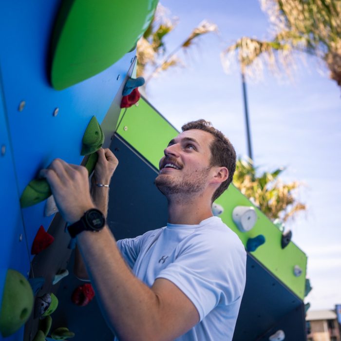 Students using the bouldering wall at The Village Green