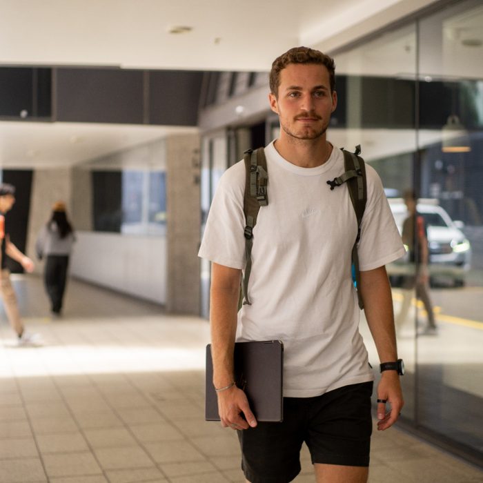 A student  outside a building on UNSW Kensington Campus