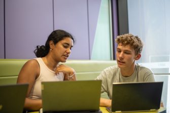 A group of students using laptops while studying indoors on UNSW Kensington Campus