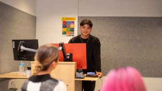 Students doing presentations in a classroom on Paddington Campus