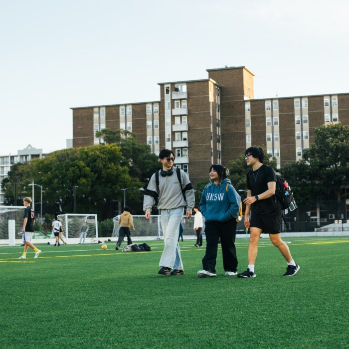 Students walking across Village Green