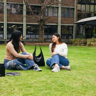 Students sitting on a lawn