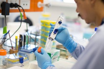 A lab technician working with a pippette 