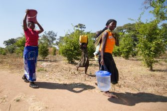 Women in Tanzania carrying water