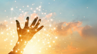 An outstretched hand during sunset