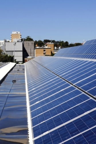 Martin and Judy Green in London, Martin holding the Faraday Medal