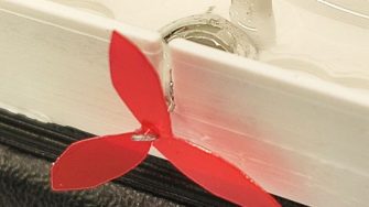 Liquid metal droplet rotary paddle motor