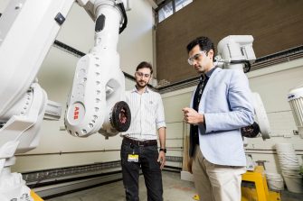 Civil Engineers examine 3D concrete printer