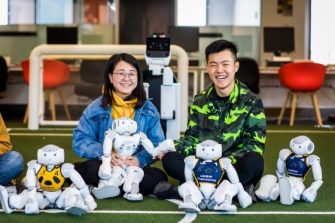 Two students involved in a robotics engineering competition