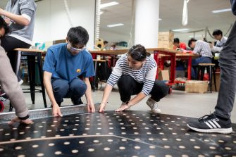 Images of students working and designing for vivid