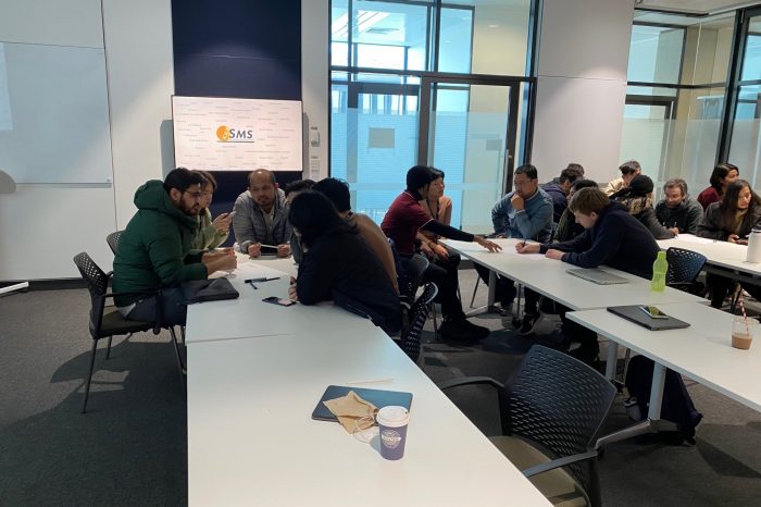 Photo of room with team