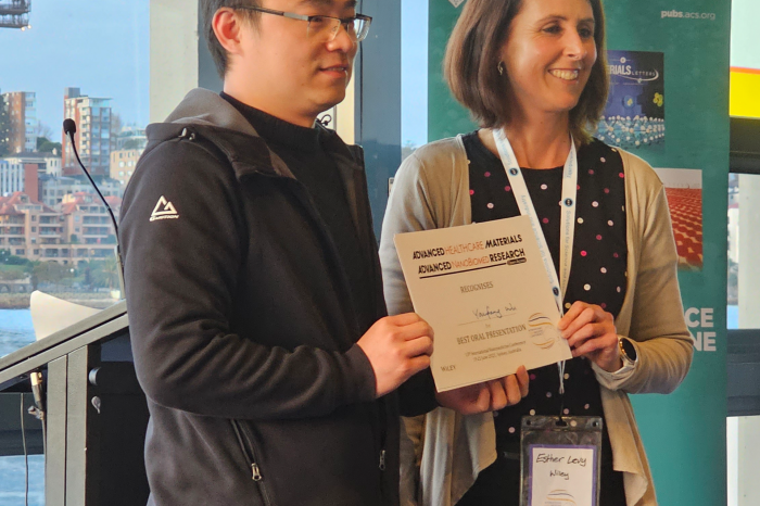 Nanomed team receiving certificate