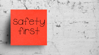 Sticky note on concrete wall, Safety First