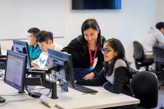 Students and teacher in a computer lab