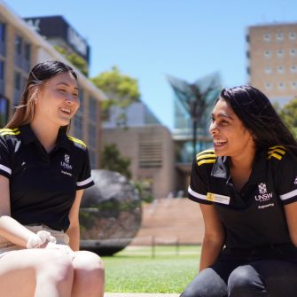 2 people in conversation on UNSW campus