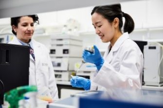 UNSW student and teacher in lab