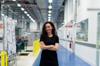 female engineer smiling in lab