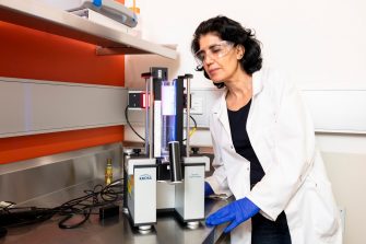 Student examining minerals in lab