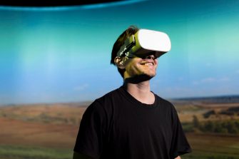 Man with Virtual Reality headset on head
