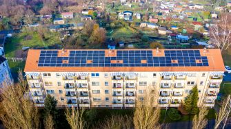 Solar panels on top of a residential building 